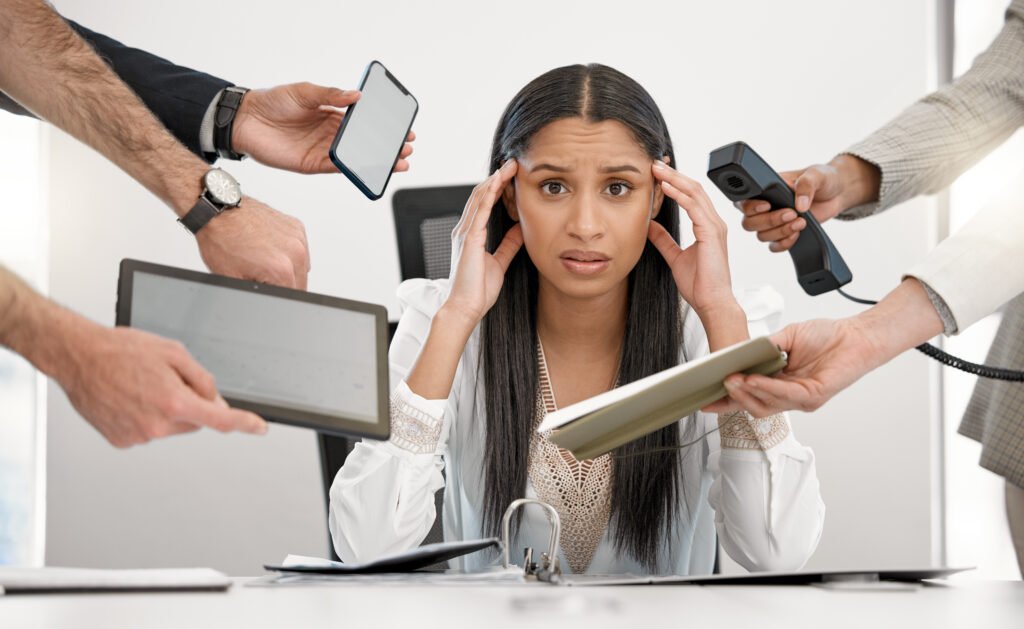 a young business woman overwhelmed with all of the technical issues she has on her digital platforms