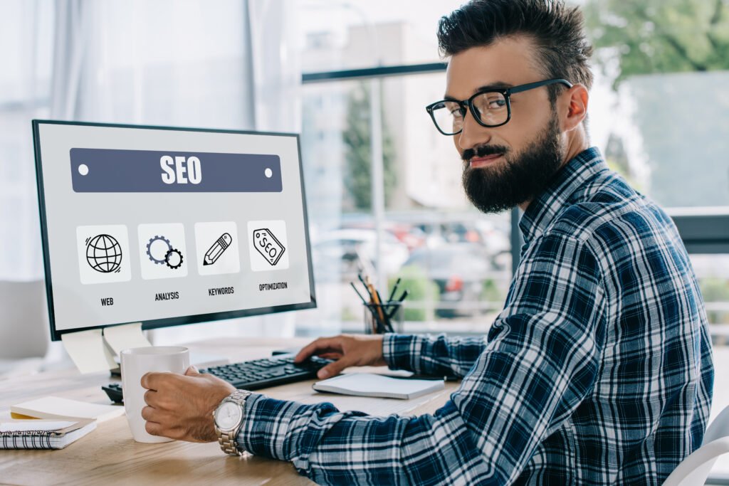 a young successful SEO expert working hard on maintaining his SEO status
