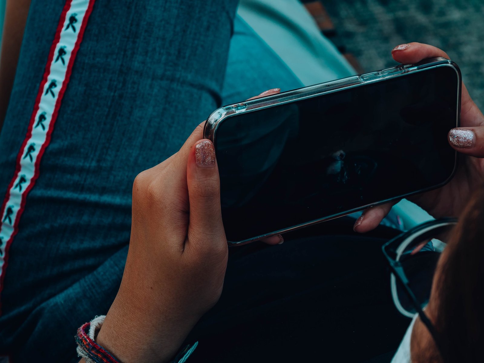 a woman using her phone to access a realtor website
