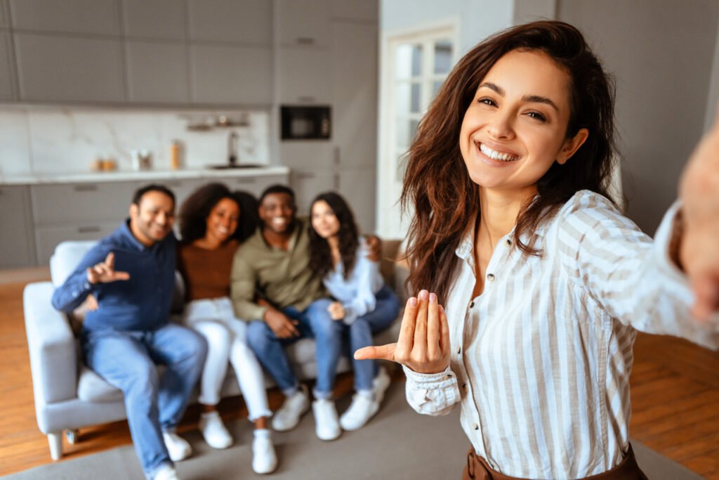realtor woman influencer taking selfie with friends