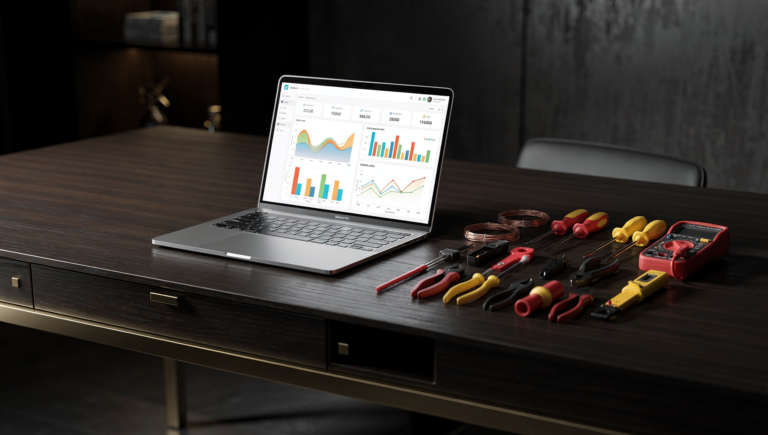 Laptop analytics dashboard beside neatly arranged electrician tools on a desk